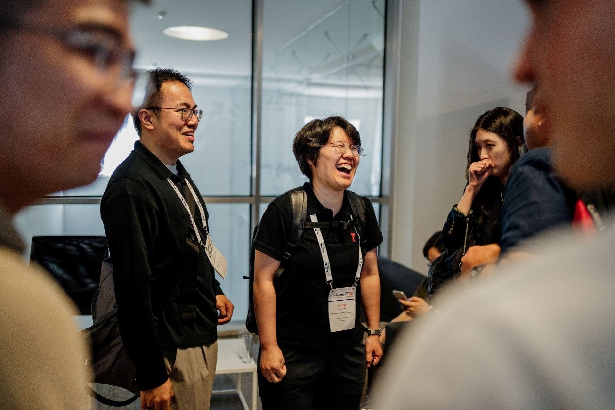 Guo Yuxin networking with fellow researchers at a conference session